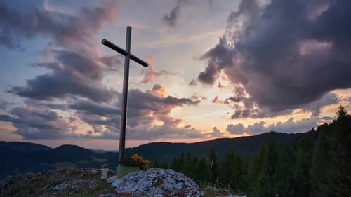 Cross Overlooking Mountain Range at Sunset Time-Lapse