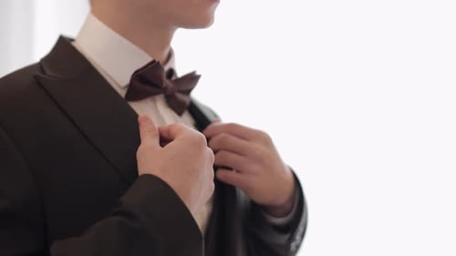 Handsome Stylish Groom Man Wearing Green Jacket at Home in Living Room Slow Motion Indoors Portrait