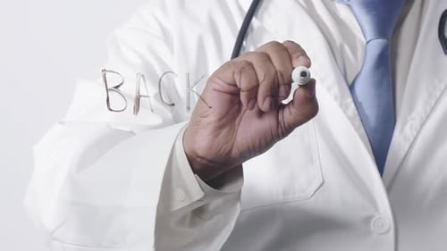 Asian Doctor Writing Back Pain