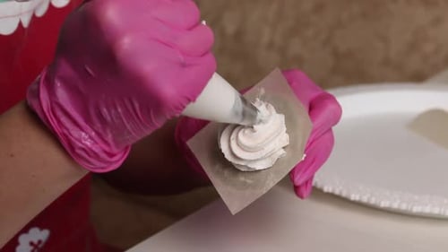 A Woman Makes Cones From Marshmallows. Shapes Them With A Pastry Bag. Close Up Shot
