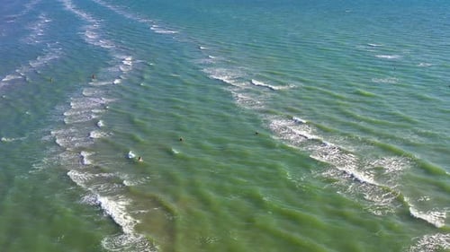 Beautiful flight in the summer over the sea. Green-blue sea, Lonely people walk, swim in the sea
