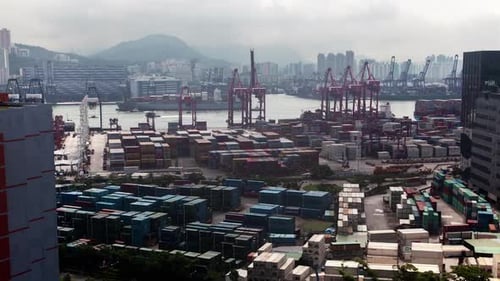 Container Port Hong Kong Harbor with Cargo Ships Against City