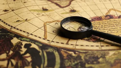 Close Up of Vintage Nautical Map with Magnifying Glass