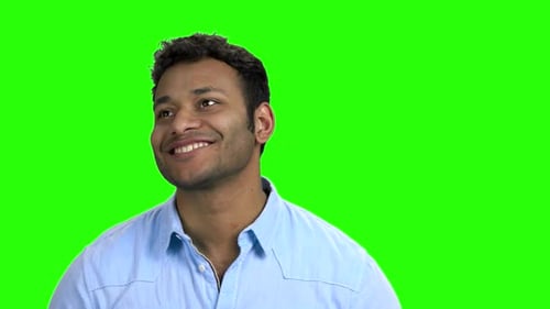 Young Adult Man Smiling and Looking Around