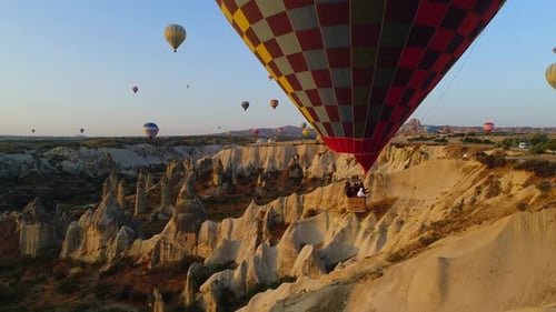 Hot Air Balloons Flying Over Cappadocia Landscape
