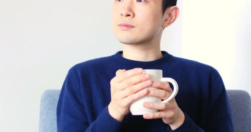 Thoughtful man having coffee 4k