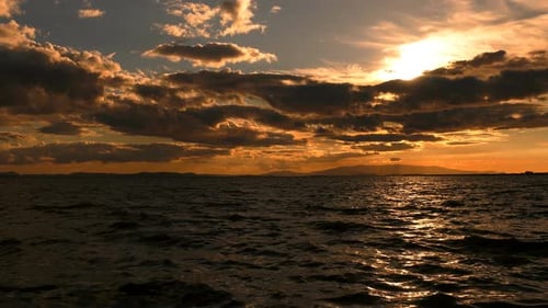 The Sea And Orange Clouds