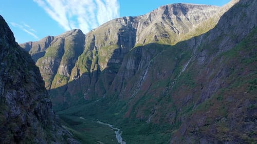Tall Mountain chain row of mountain range, flying low, Aerial