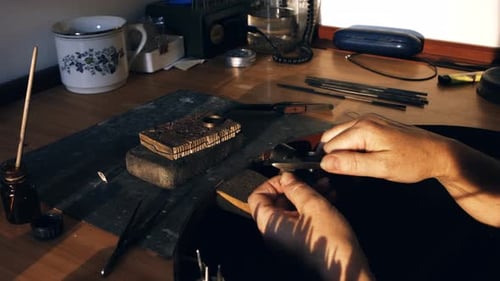 Goldsmith preparing ring