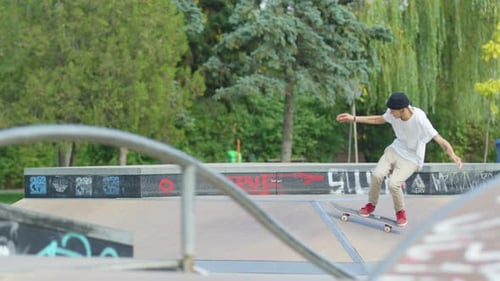 Young Adult Performs Skateboard Trick in Urban Park