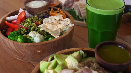 Big Trendy Vegan Meal for Two From Veggie Bowls with Sauces Green Healthy Smoothie and Organic Roll