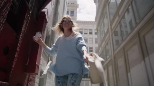 Attractive Young Traveler Lady Walking on City Street Turning to Camera Smiling