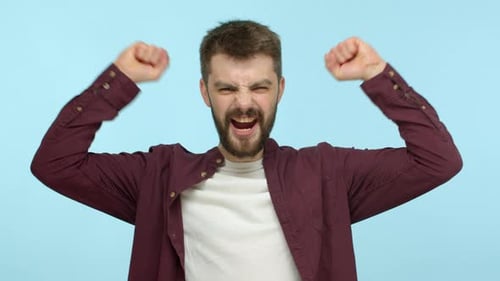 Excited Man Pumping Fists in Celebration