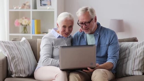 Senior Couple Using Laptop Together at Home