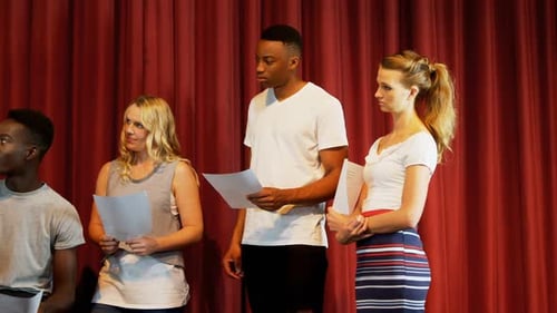 Theater Students Rehearsing with Scripts