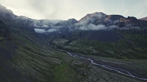 Aerial View of Mountainous Landscape with Waterfall