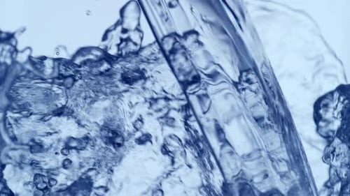 Clear Water Poured in Abstract Blue Background