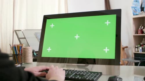Male Hands Typing a Text on a Computer with Green Screen on