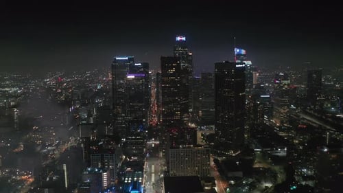 Aerial View of Illuminated City with Fireworks at Night