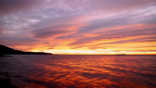 Golden Sunrise or Sunset Over Calm Ocean Waters