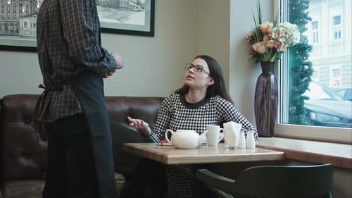 Woman Swear Tea in the Cafe.
