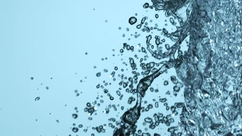 Water pouring and splashing in ultra slow motion 1500fps on a reflective surface - WATER POURS