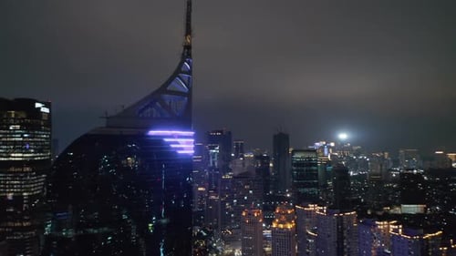 Close Up Aerial Shot of Skyscraper Antenna of Wisma 46 Skyscraper in Jakarta at Night with