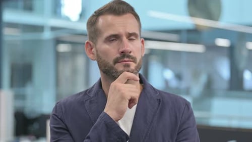 Pensive Middle Aged Businessman Thinking and Getting Idea