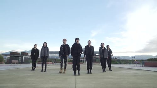 Young STREET PERFORMER performing on the street. Seven chinese teenagers dancing kpop