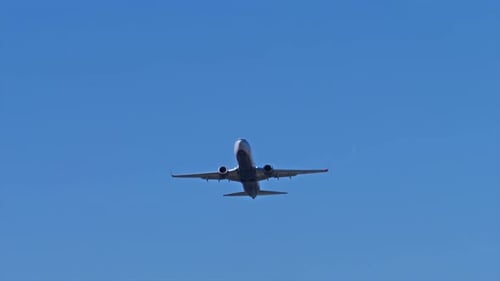 Airplane Take Off In Blue Sky