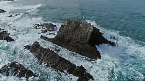 Aerial Around View of Sea Waves and Rocks
