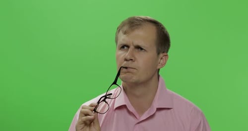 Handsome Thoughtful Man in Pink Shirt Thinks About Something. Chroma Key