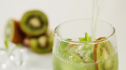 Refreshing Kiwi Drink with Ice and Mint