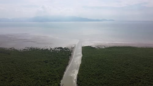 Aerial look down river toward sea