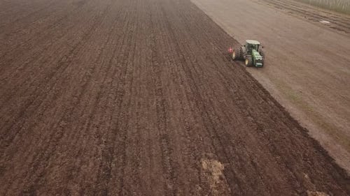 Tractor Plows a Field