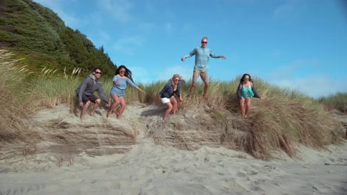Super slow motion shot of friends jumping at beach, shot with Phantom Flex 4K