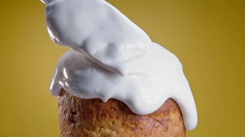 Closeup of Rotating Easter Cake Decoration with White Glaze Traditional Bakery