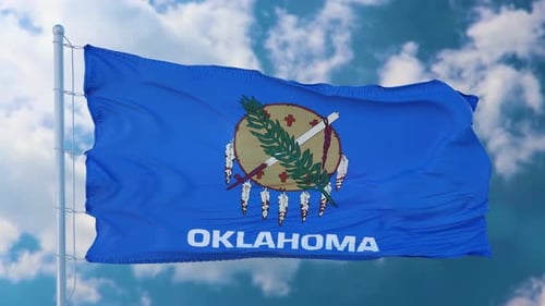 Realistic Oklahoma State Flag Waving Against a Cloudy Sky