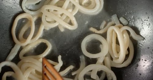 Squid Rings Cooking in a Pan
