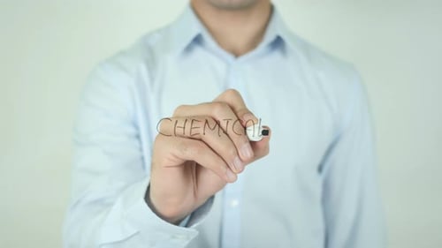 Man Writing Chemicals on Transparent Surface Close Up