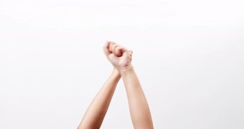 Close up of a fist bump opportunity for cooperation isolated on a white studio background with copy