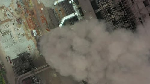Aerial View of Industrial Plant Emitting Smoke