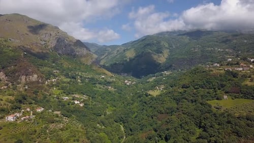 Aerial View of Mountain Gorge Hills Covered with Green Forest. Italian Landscape Sunny Weather