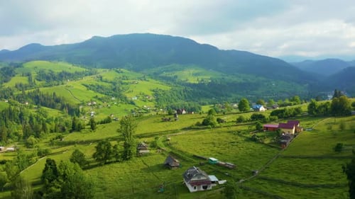 Aerial View of a Green Rural Area Under Blue Sky