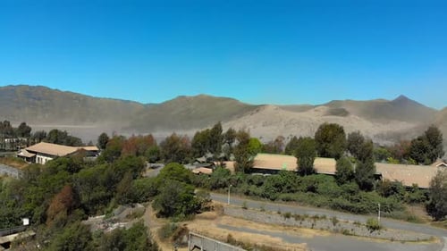 Aerial View on Famous Active Bromo Volcano or Mount Gunung Bromo and Batok Volcano Inside