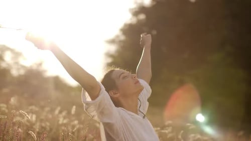 Beautiful Carefree Woman in Fields Being Happy Outdoors