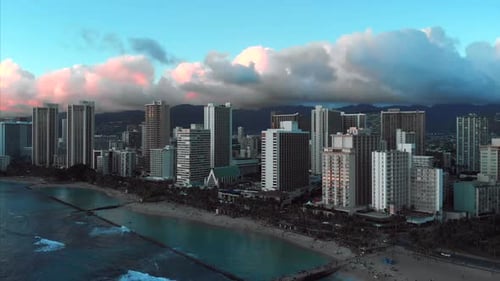 Aerial drone footage of Honolulu, Hawaii.
Beautiful real estate, buildings in the city.
Palm trees