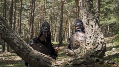 Medieval Warriors with Swords in Forest