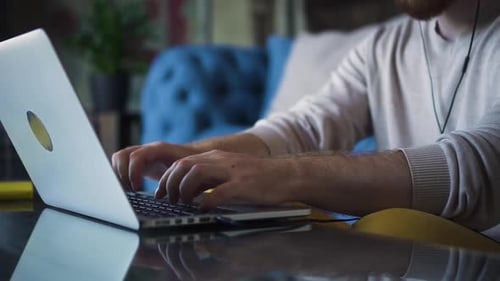 Close Up Man Hands Typing on Laptop Keyboard