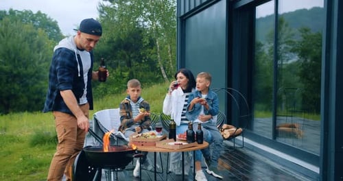 Family Enjoying an Outdoor Meal on Cabin Porch